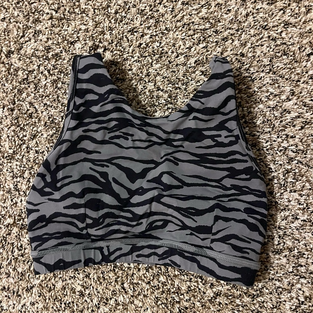 Black and grey zebra print sports bra